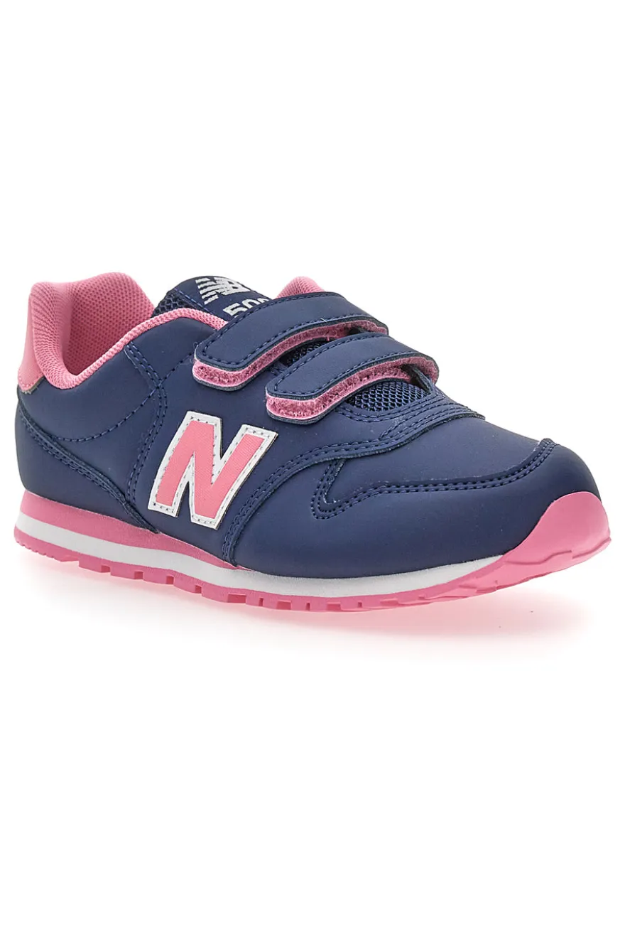 Blaue Sneakers New Balance 500 mit rosa Details und Klettverschluss
