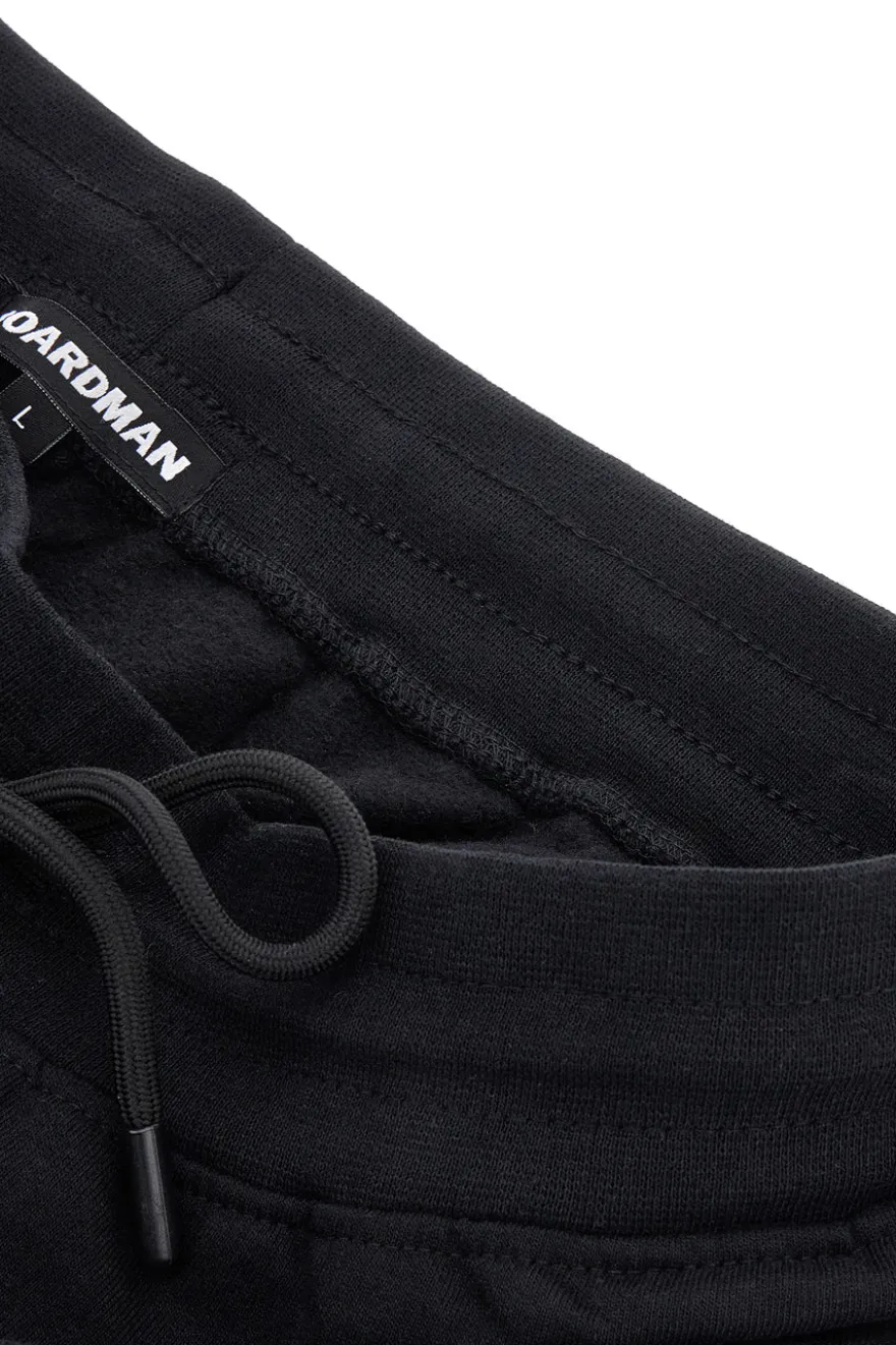 Pantaloni neri in felpa con zip Boardman NBY814