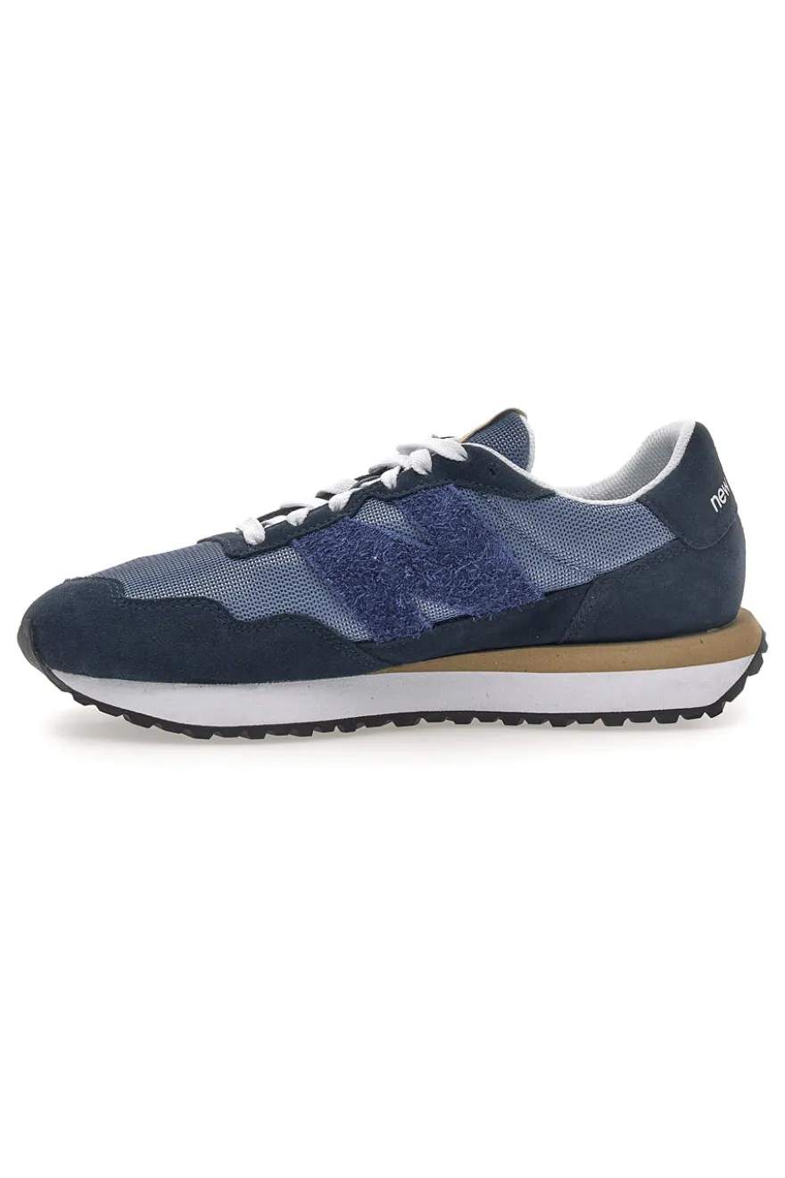 Sneaker blu inserti in pelle New balance M2374EK