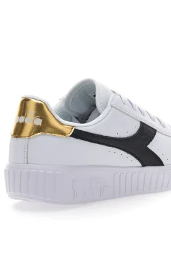 Weiße Sneakers mit schwarzem und goldenem Logo DIADORA GAME STEP SKIN GS