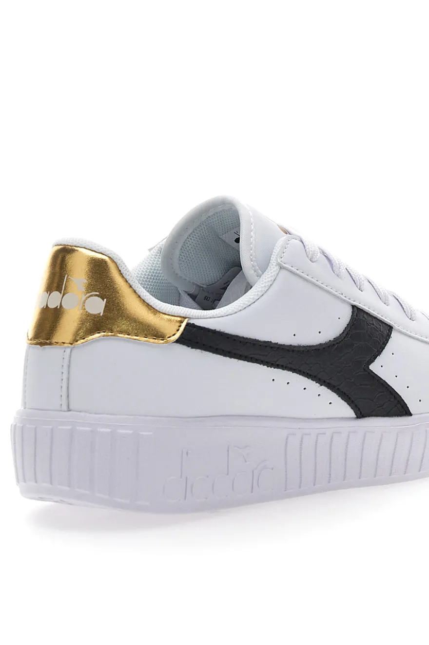 Weiße Sneakers mit schwarzem und goldenem Logo DIADORA GAME STEP SKIN GS